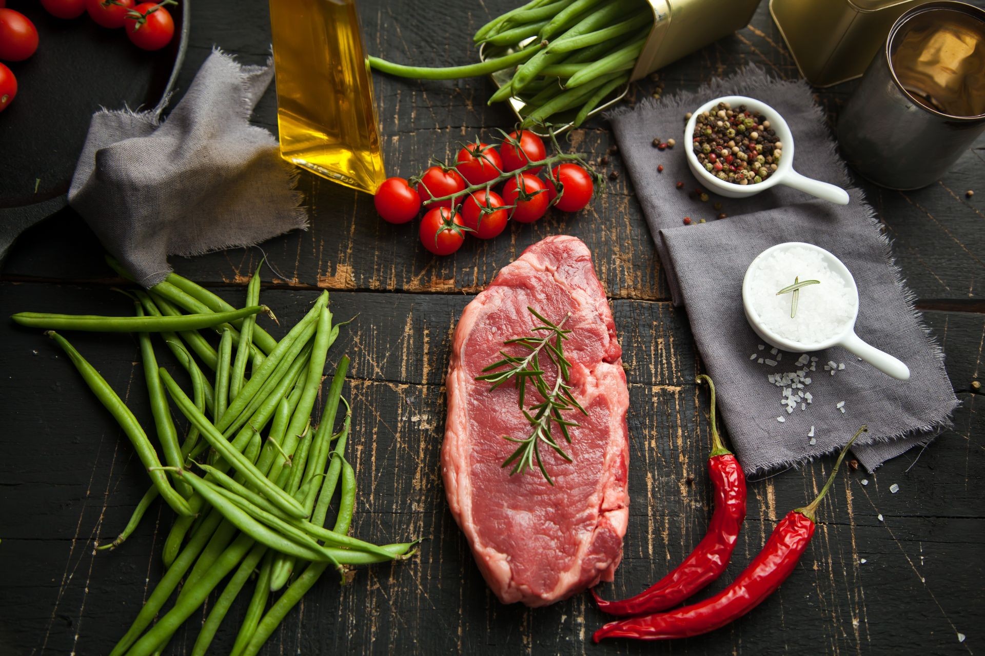 Fresh meat. beef steak on wooden cutting board. Top view.